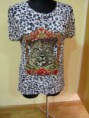 Blusa estampado de leopardo y motivo felino.